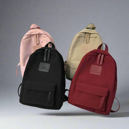 Durable and spacious solid nylon backpack for both men and women, ideal for school or travel, available in various colors