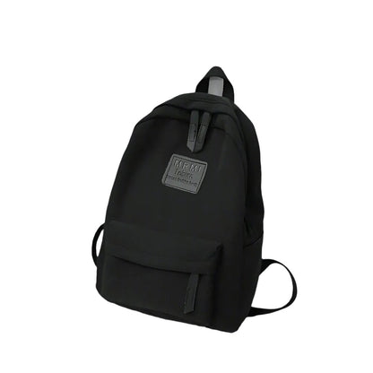 Durable and spacious solid nylon backpack for both men and women, ideal for school or travel, available in various colors