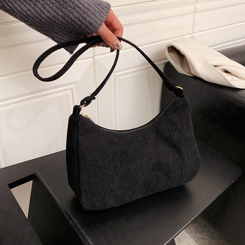 The New Style Armpit Trendy Simple Shoulder Handbag combines street fashion with functionality. Made from cotton and linen, it features a soft surface, a sandwich pocket, and a mobile phone compartment, making it perfect for daily use. Available in four classic colors.

