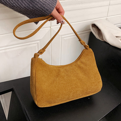 The New Style Armpit Trendy Simple Shoulder Handbag combines street fashion with functionality. Made from cotton and linen, it features a soft surface, a sandwich pocket, and a mobile phone compartment, making it perfect for daily use. Available in four classic colors.

