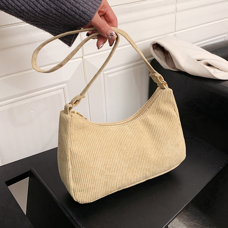 The New Style Armpit Trendy Simple Shoulder Handbag combines street fashion with functionality. Made from cotton and linen, it features a soft surface, a sandwich pocket, and a mobile phone compartment, making it perfect for daily use. Available in four classic colors.

