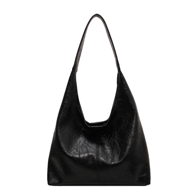 The Vintage Designer Casual Tote Bag is perfect for autumn and winter fashion, offering a large capacity and stylish dumpling shape with soft PU material. Available in five colors, it features a single shoulder strap and a unique sewing line detail for added charm.

