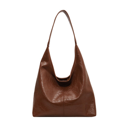 The Vintage Designer Casual Tote Bag is perfect for autumn and winter fashion, offering a large capacity and stylish dumpling shape with soft PU material. Available in five colors, it features a single shoulder strap and a unique sewing line detail for added charm.

