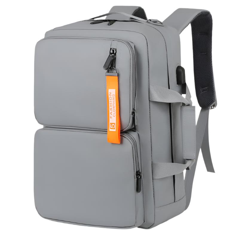 This multifunctional backpack is designed for business, travel, and commuting. With a large capacity, it comfortably fits up to a 16-inch laptop and includes a USB port for on-the-go charging. Available in gray and black, this Oxford cloth backpack combines style, comfort, and practicality for professionals and students alike.

