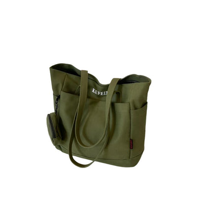 Elevate your daily commute with this Canvas Shoulder Leisure Tote Bag. Featuring a horizontal square design, it comes in black-brown, white, khaki, and army green. Made from durable canvas, the bag includes a three-dimensional pocket and a mobile phone compartment. Perfect for street trend styles and daily matching.
