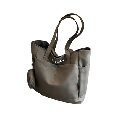 Elevate your daily commute with this Canvas Shoulder Leisure Tote Bag. Featuring a horizontal square design, it comes in black-brown, white, khaki, and army green. Made from durable canvas, the bag includes a three-dimensional pocket and a mobile phone compartment. Perfect for street trend styles and daily matching.

