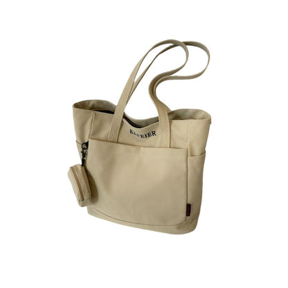 Elevate your daily commute with this Canvas Shoulder Leisure Tote Bag. Featuring a horizontal square design, it comes in black-brown, white, khaki, and army green. Made from durable canvas, the bag includes a three-dimensional pocket and a mobile phone compartment. Perfect for street trend styles and daily matching.
