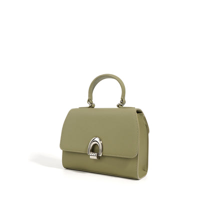 The Women's Simple Textured Cowhide Handbag is crafted from soft, genuine leather with a stylish shell shape and sandwich pocket. Its urban simplicity design makes it the perfect commuter bag, available in avocado green, black, and ivory white.
