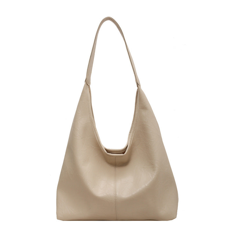 The Vintage Designer Casual Tote Bag is perfect for autumn and winter fashion, offering a large capacity and stylish dumpling shape with soft PU material. Available in five colors, it features a single shoulder strap and a unique sewing line detail for added charm.
