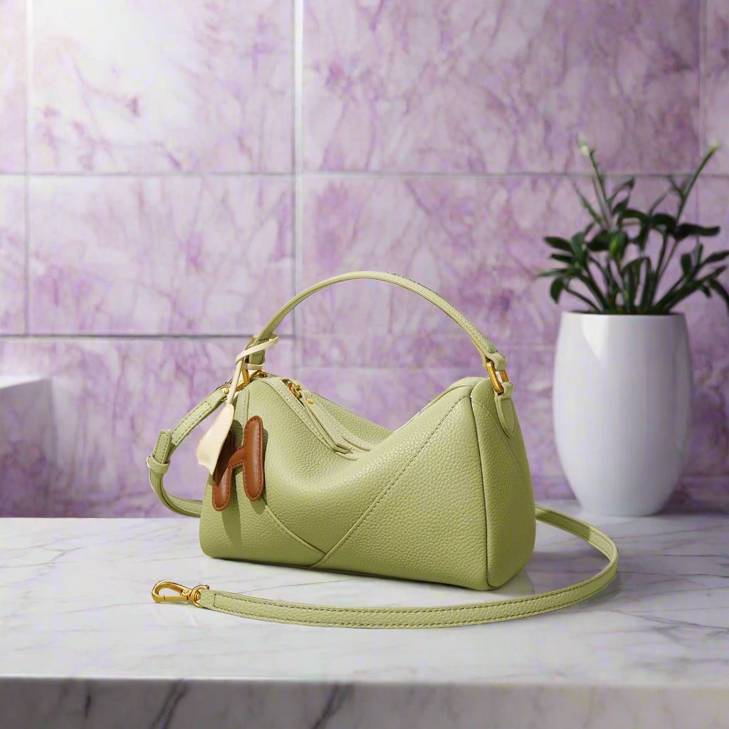 Elegant textured cowhide shoulder bag, made from soft genuine leather, perfect for a chic and refined look