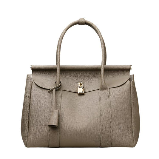 The Women's Fashionable High-end Large-capacity Handbag, crafted from premium first-layer cowhide leather, features a spacious horizontal square design, making it ideal for business commutes. Available in khaki, black, and white, it’s both stylish and practical.

