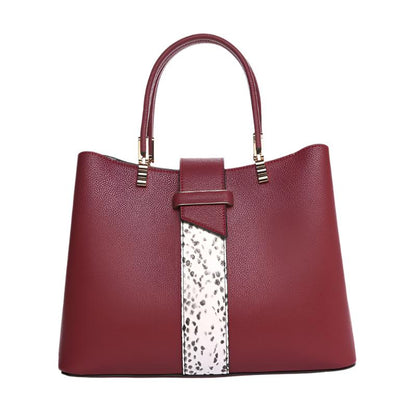 This Women's Large Capacity Cross-body Handbag is made from two-layer cow leather with a sleek horizontal square design. It features an adjustable strap, multiple internal pockets, and a secure zipper closure. Available in wine red, blue, and black, it's perfect for both fashion and practicality.

