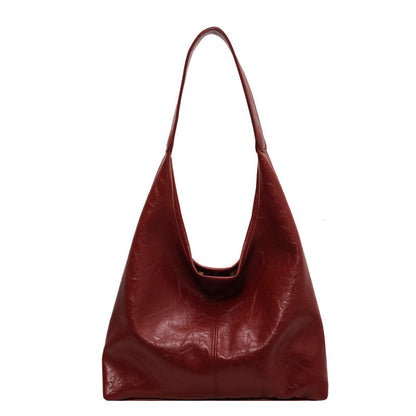 The Vintage Designer Casual Tote Bag is perfect for autumn and winter fashion, offering a large capacity and stylish dumpling shape with soft PU material. Available in five colors, it features a single shoulder strap and a unique sewing line detail for added charm.

