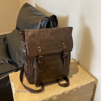 Retro Large Capacity Commuter Travel Bag in PU leather, perfect for daily use. Features a sandwich pocket, double-shoulder straps, and an all-matching design in black or brown. Soft and stylish with sewing thread accents.

