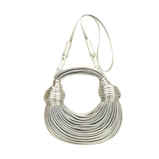 The Instafamous Metal Noodles Underarm Bag combines a shiny surface with soft PU material, making it a trendy accessory for any street style. Its round shape and zipper transfer bag add functionality to fashion.

