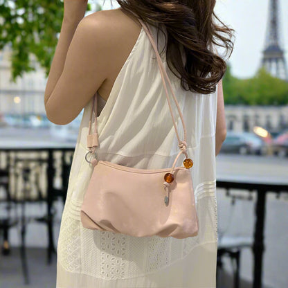 olid color pink shoulder bag, stylish and practical single-shoulder design for everyday use.